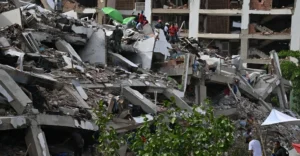 Collapsed residential buildings after the Venezuela Earthquake as rescue teams search through the rubble for survivors.