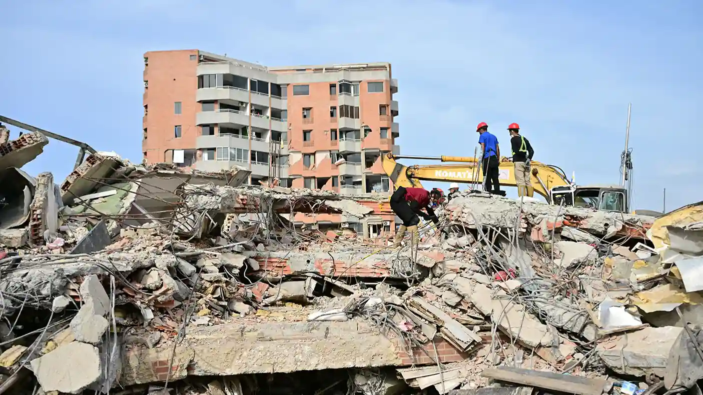 Rescue workers search through collapsed buildings after the Venezuela Earthquake in La Guaira as the death toll nears 3,000.