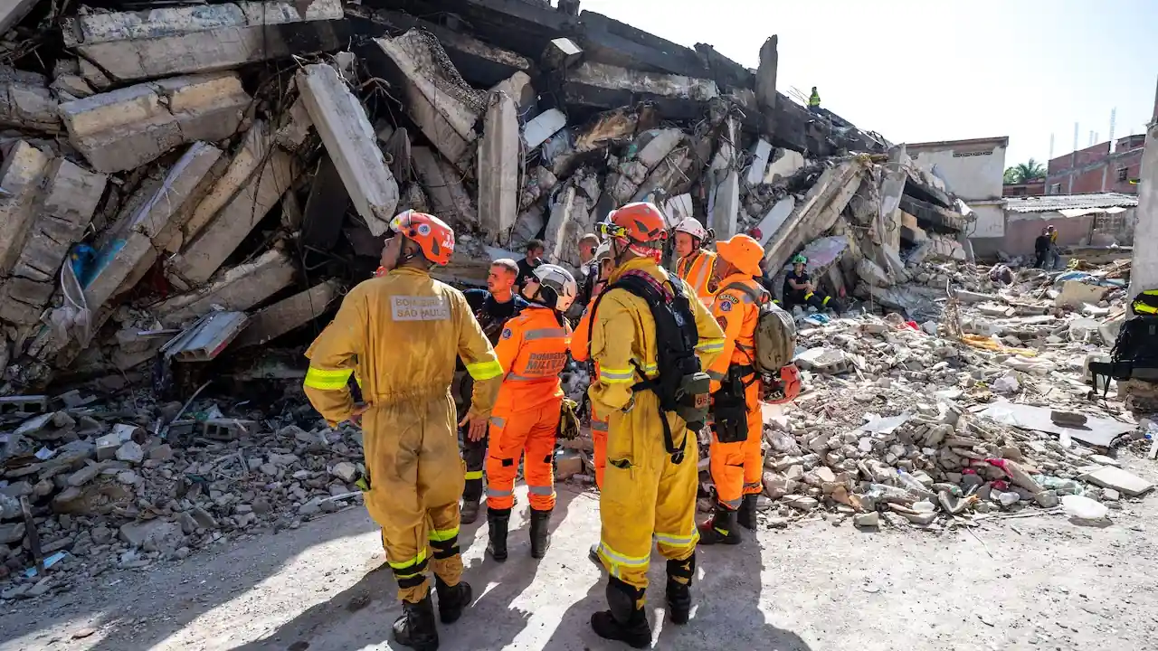 International rescue workers search through collapsed buildings during the Venezuela Rescue operation after devastating earthquakes.