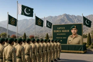 Pakistan Army soldiers pay tribute to Captain Hamza Akram Shaheed martyred in Hangu operation with national flags and mountain backdrop