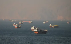 Oil tankers and cargo vessels navigating the Strait of Hormuz near Musandam Oman as part of the Hormuz plan Oman joint management agreement