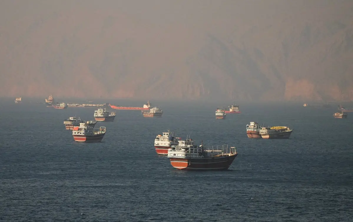 Oil tankers and cargo vessels navigating the Strait of Hormuz near Musandam Oman as part of the Hormuz plan Oman joint management agreement