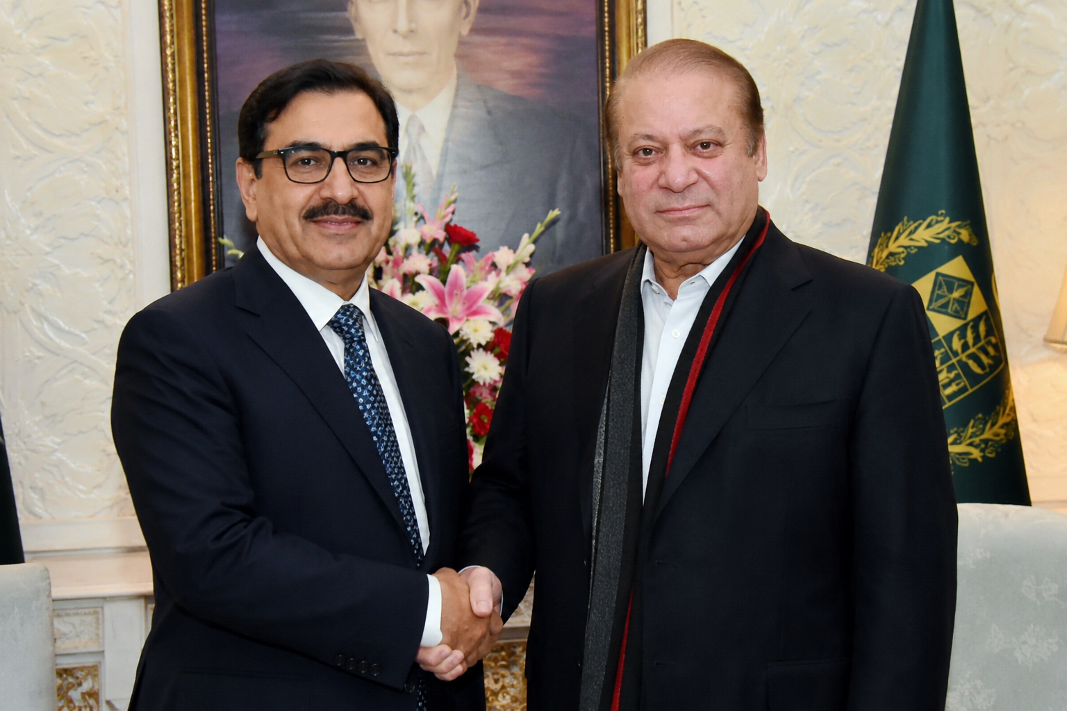 Former Prime Minister Nawaz Sharif shaking hands with Rana Sanaullah in an official meeting context.