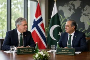 Norwegian FM Visit showing Espen Barth Eide and Ishaq Dar seated at a conference table with Norway and Pakistan flags during bilateral discussions on trade climate and renewable energy
