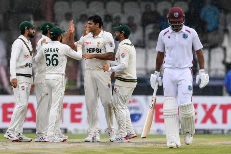 Pakistan players celebrate an early wicket during the rain affected Pakistan West Indies Test at Queen's Park Oval.