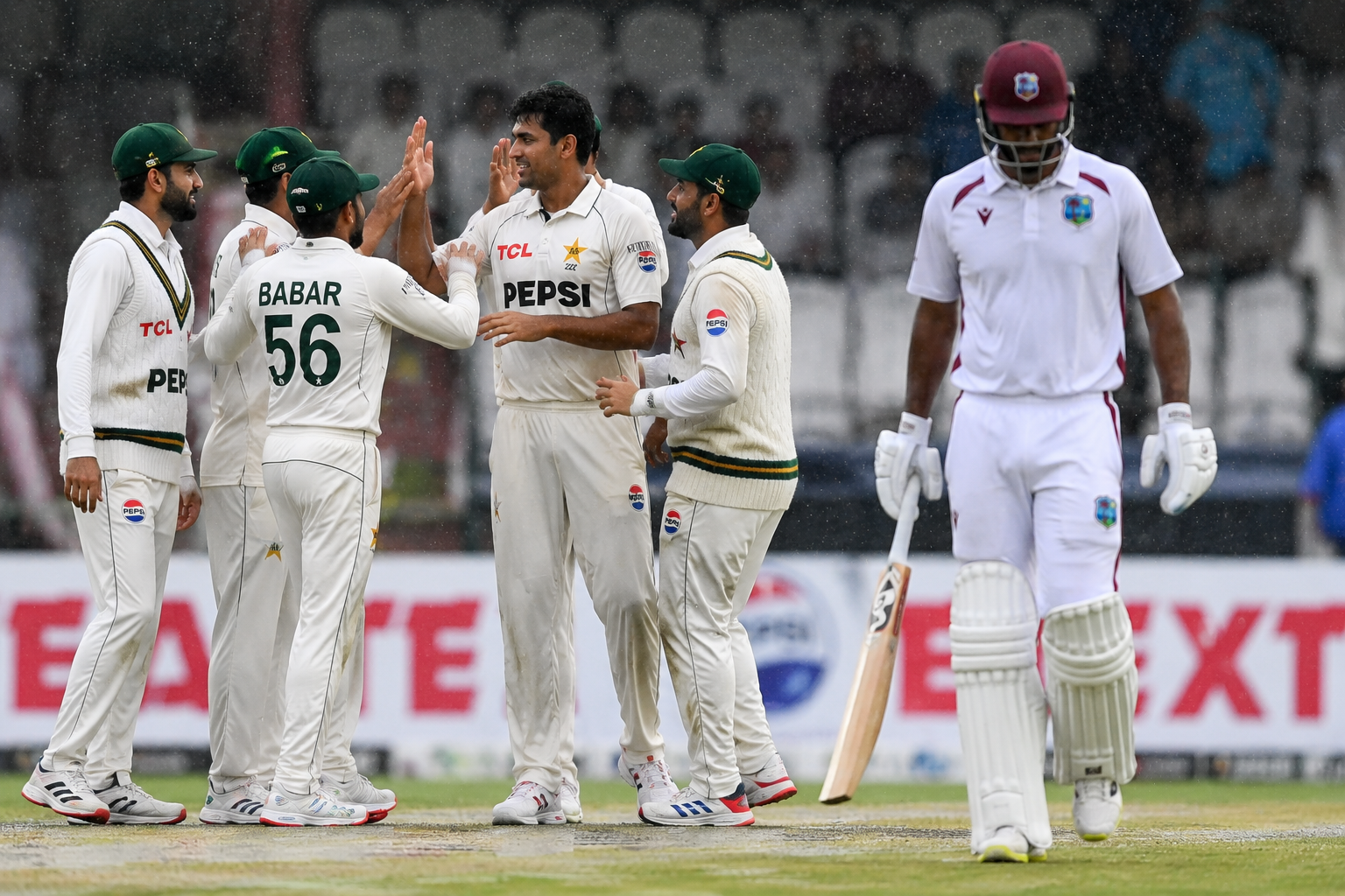 Pakistan players celebrate an early wicket during the rain affected Pakistan West Indies Test at Queen's Park Oval.