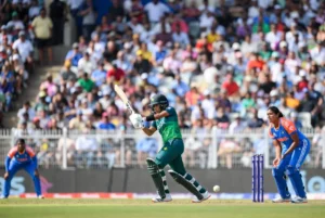Pakistan batter in green jersey plays shot against India during Women’s T20 Asia Cup cricket match in stadium