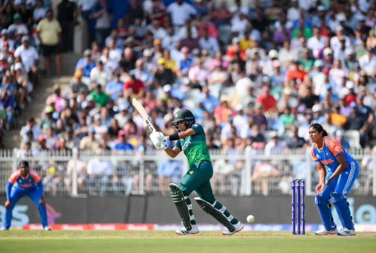 Pakistan batter in green jersey plays shot against India during Women’s T20 Asia Cup cricket match in stadium