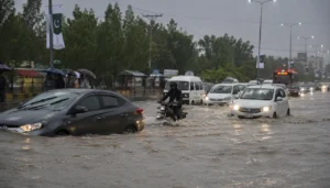 Heavy rain causes urban flooding on a city road with vehicles and pedestrians