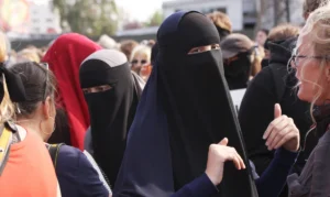 Women wearing burqas during discussion of Italy's school burqa ban
