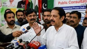 PML-N candidate Malik Munir Iqbal Channar addressing media microphones after winning NA-168 Bahawalpur by-election