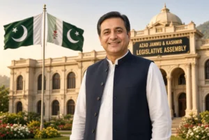 Dr Najeeb Naqi AJK elected as president standing outside Azad Jammu and Kashmir Legislative Assembly with Pakistani and AJK flags