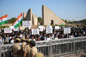 Young protesters holding placards at Jantar Mantar during CJP protest demanding election chief resignation and electoral reforms