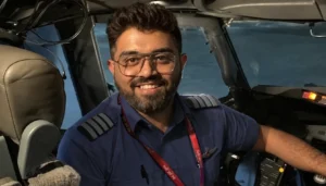 Indian pilot attack survivor Smit Machchhar smiling in hospital bed with bandages after Dubai Tel Aviv flight incident