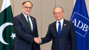 Ahsan Iqbal and ADB president shaking hands during ML-1 project meeting