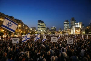 Netanyahu rally Tel Aviv large night protest with Israeli flags and demonstrators demanding accountability